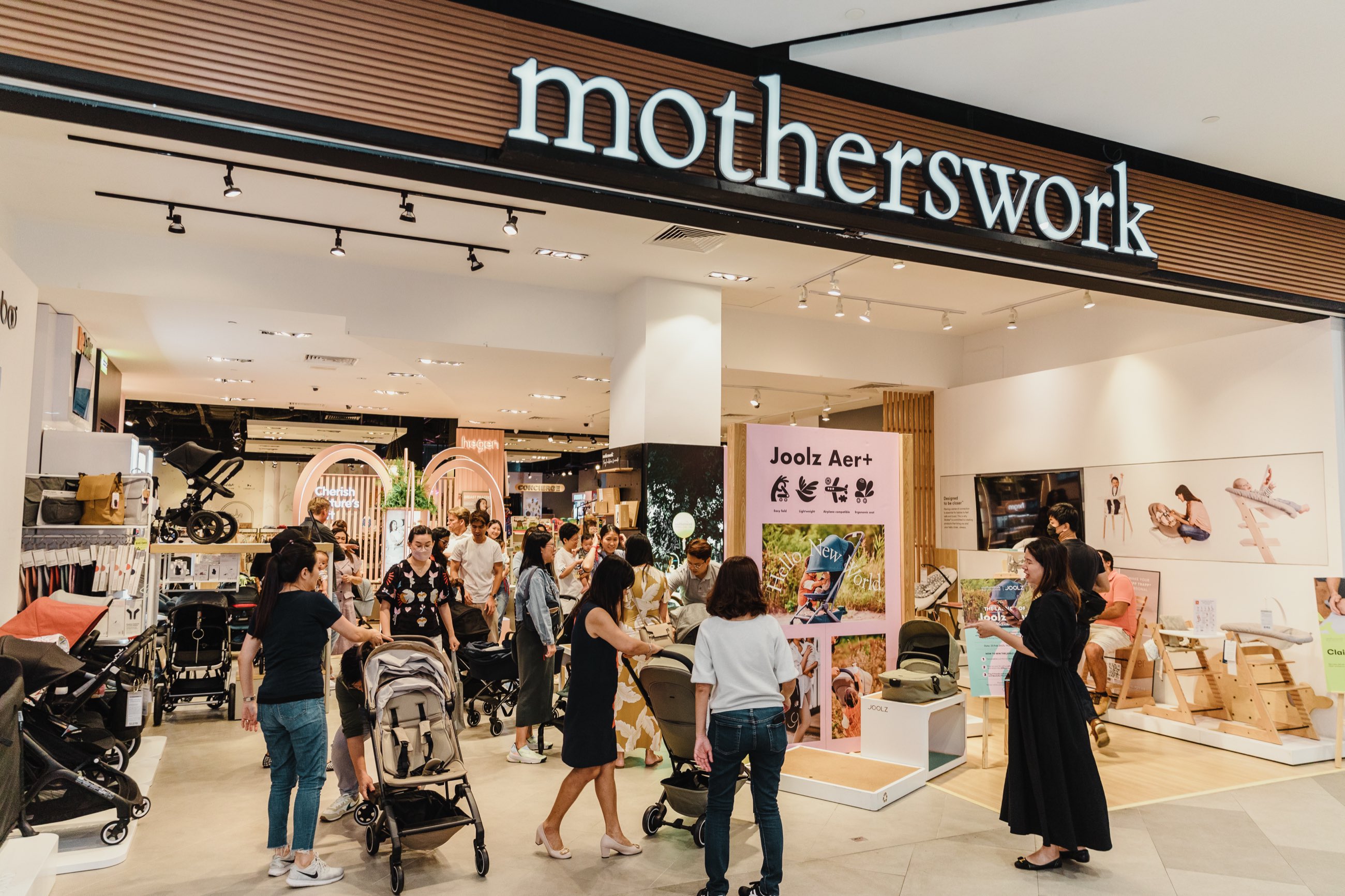 Families with strollers shopping at a Motherswork store