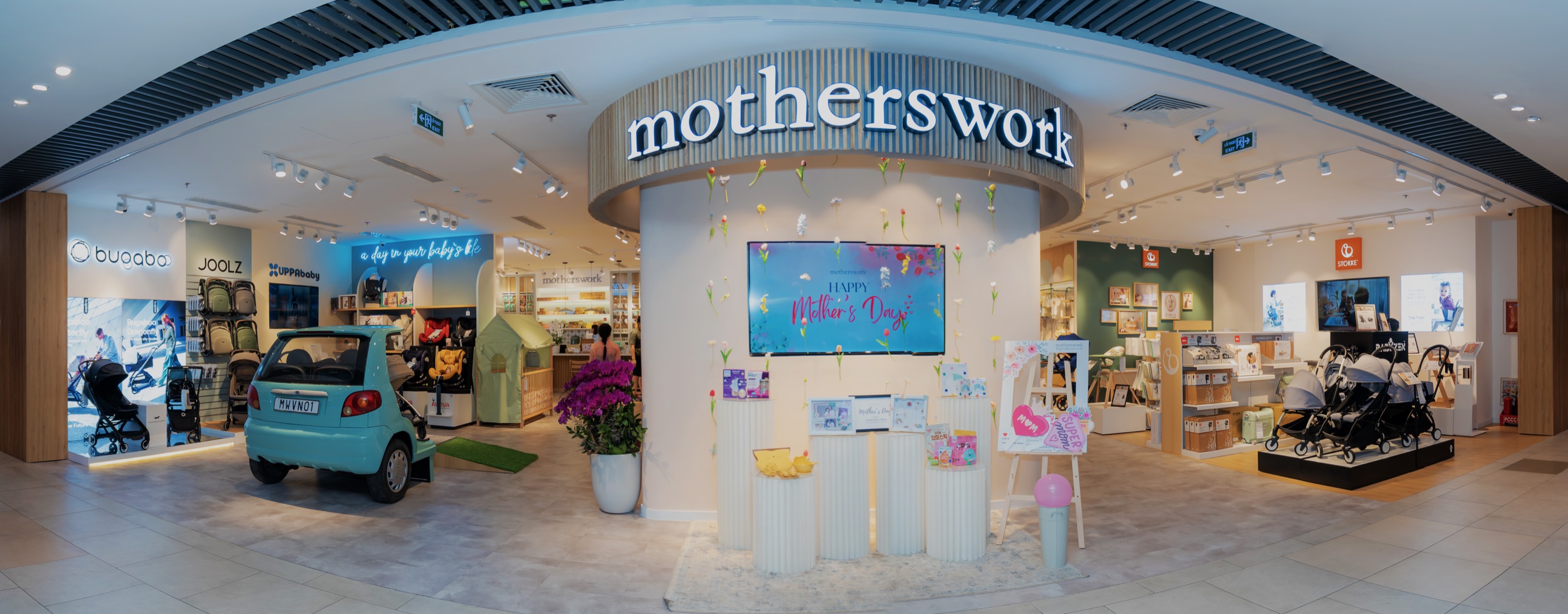 A Motherswork store in Vietnam, dressed for Mother's Day, with strollers and nursery furniture