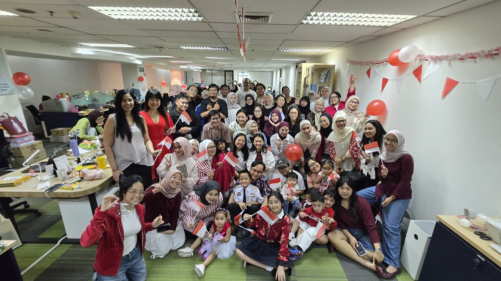 The Indonesia team and their children celebrating Independence Day, 2026